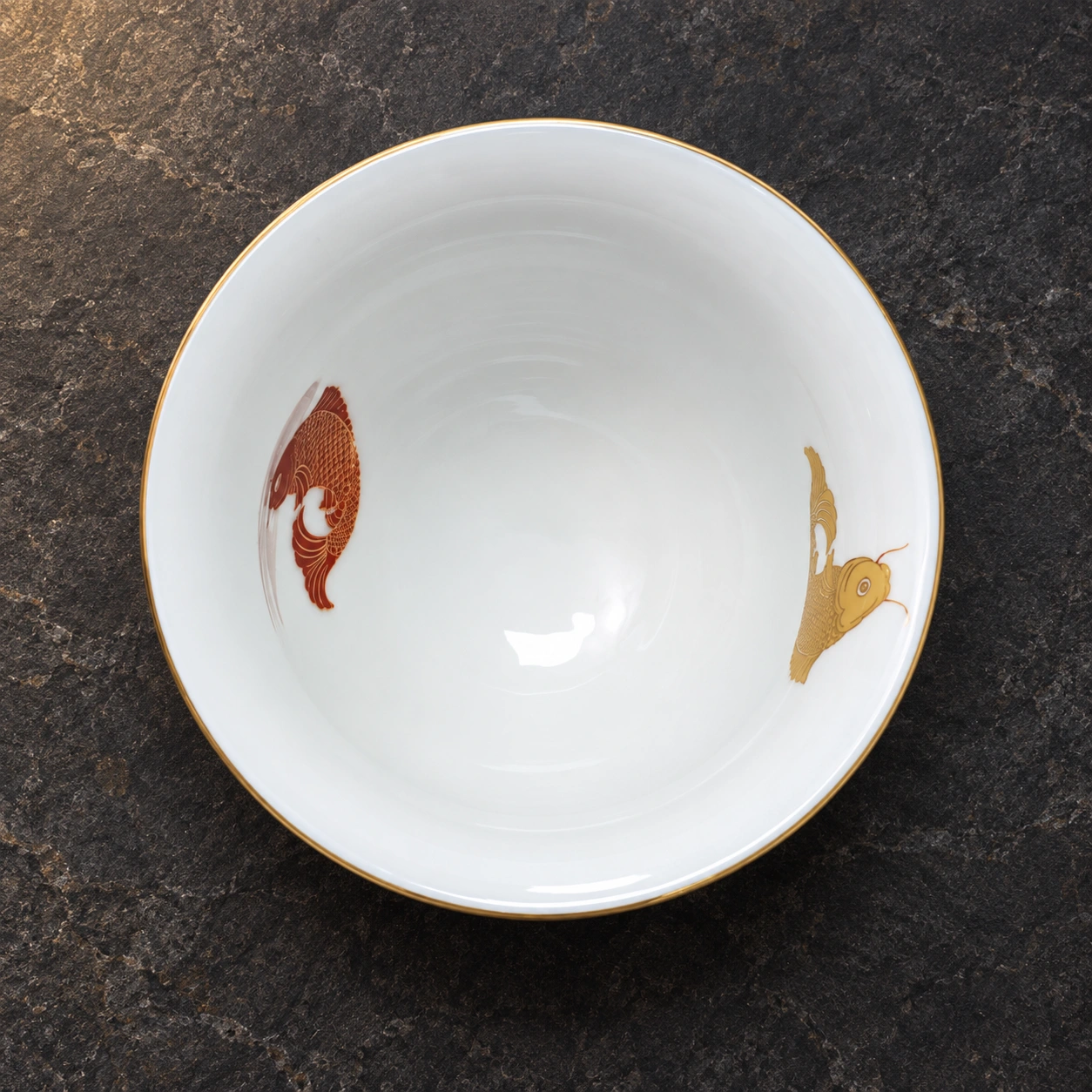 茶汤渐浅，双鱼显现。